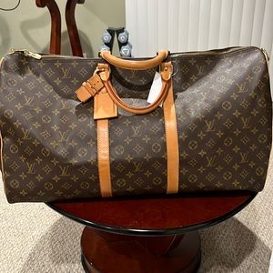 Louis Vuitton Keepall Bandoulière 60. No strap and no lock and no key included.